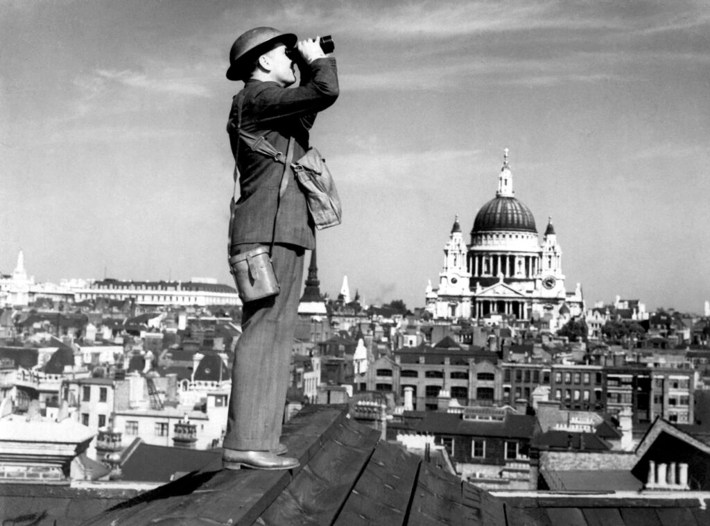 Aircraft spotter searches the sky with binoculars wwii